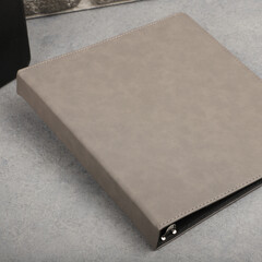Personalized binding, leather folder cover, leather binding, binder, binder, office binding, corporate gift. Concept shot leather binding, top view, colorful