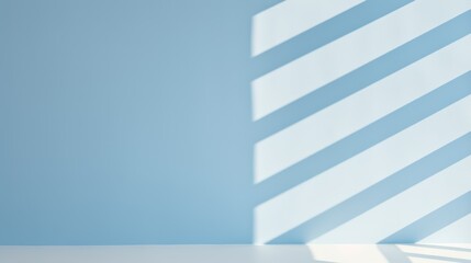 Sunlight casting soft shadows on a minimalist light blue interior wall.