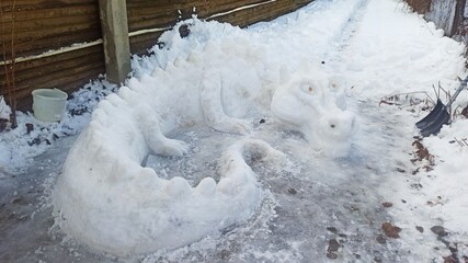 The figure of a dragon made of snow is a symbol of the New Year on Zelenograd Street