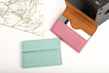 Colored leather business card holder, Genuine leather business card holder, concept shot, top view, different color, clamshell and stitched card holder. White backgorund.