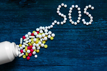 The word SOS is written on tablets - 696436384