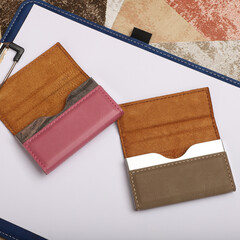 Colored leather business card holder, Genuine leather business card holder, concept shot, top view, different color, clamshell and stitched card holder