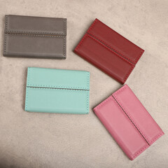 Colored leather business card holder, Genuine leather business card holder, concept shot, top view, different color, clamshell and stitched card holder