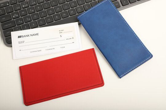 Colorful leather checkbook. Genuine leather checkbook, concept shot, top view, different color, clamshell and stitched checkbook