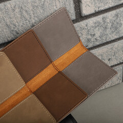 Colorful leather checkbook. Genuine leather checkbook, concept shot, top view, different color, clamshell and stitched checkbook