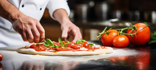hand closeup of chef preparing italian pizza in kitchen. banner with copy space