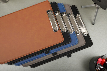Colorful leather clipboard. Genuine leather clipboard, concept shot, top view, different color,...
