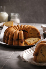 homemade marble cake on a rustic plate with rustic grey tiles background