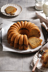 homemade marble cake on a rustic plate with rustic grey tiles background