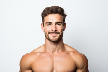 Fototapeta premium Young confident european man athlete looking at camera. Handsome brown hair