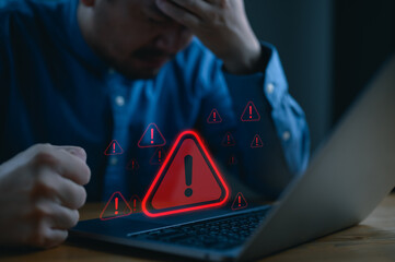 User is using computer with triangle caution warning sign for notification error and maintenance...