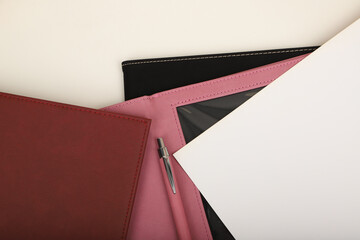 Colorful leather diploma holder. Concept shot, top view, different color, clamshell and stitched diploma holder, A new leather award board certificate and diploma frame