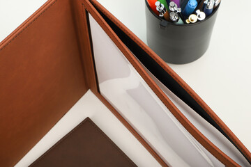 Colorful leather diploma holder. Concept shot, top view, different color, clamshell and stitched...