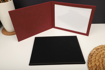 Colorful leather diploma holder. Concept shot, top view, different color, clamshell and stitched...