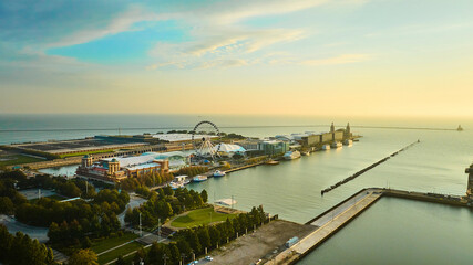 Navy Pier on Lake Michigan at sunrise with aerial of Ferris Wheel at dawn, Chicago, IL