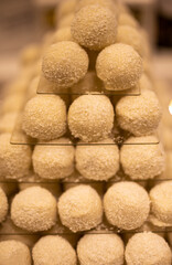 Heap of choconut balls in candy store.