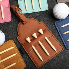 Colorful leather Golf Tee Holder. Concept shot, top view, different color. Golf tee.