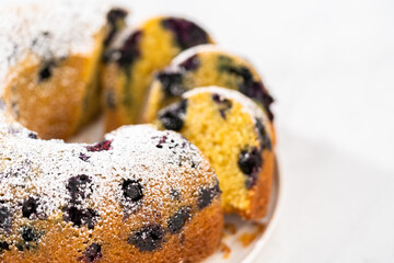 Lemon blueberry bundt cake with powdered sugar dusting