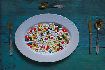 pills like food on a plate - 696491923