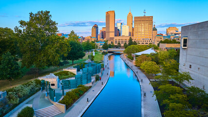 Aerial Golden Hour Cityscape with Tranquil Canal Reflections