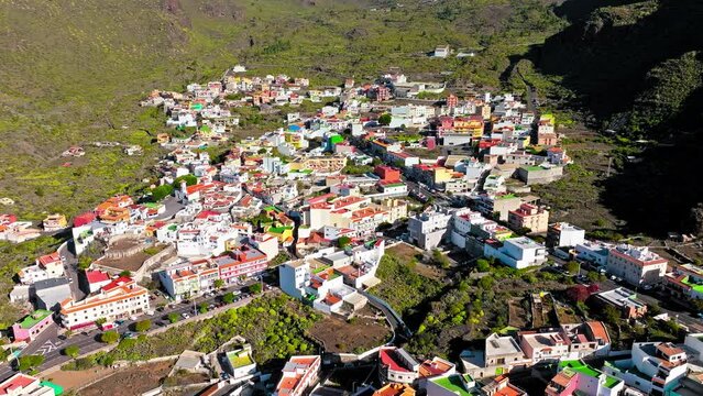 Drone view of colourful houses in Tamaimo village, Tenerife, Canary Islands. Aerial view of Tamaimo tropical, Santa Cruz de Tenerife, Spain.