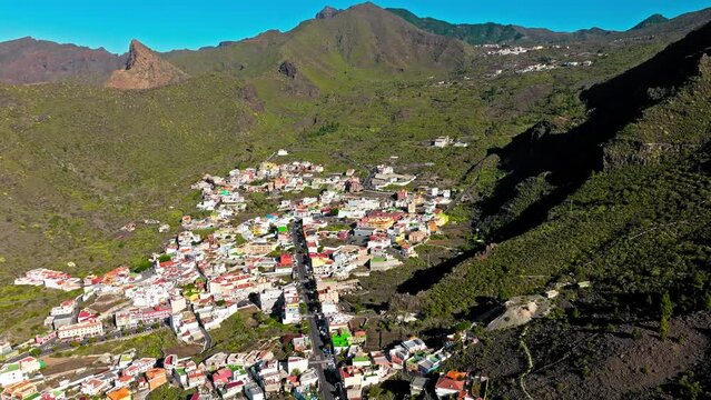 Drone view of colourful houses in Tamaimo village, Tenerife, Canary Islands. Aerial view of Tamaimo tropical, Santa Cruz de Tenerife, Spain.