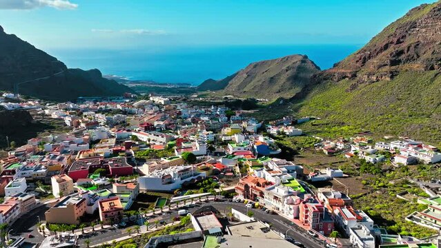 Drone view of colourful houses in Tamaimo village, Tenerife, Canary Islands. Aerial view of Tamaimo tropical, Santa Cruz de Tenerife, Spain.