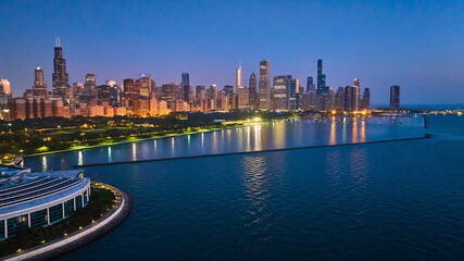 Fototapeta na wymiar Chicago coast aerial with city lights reflected at night on Lake Michigan water near Shedd Aquarium