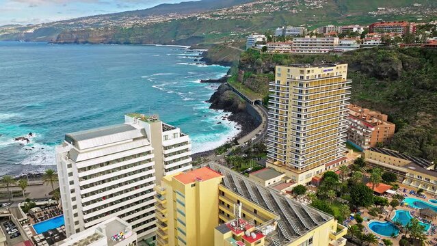 Aerial view of skyscraper buildings and colourful houses in Santa Cruz de Tenerife. Old town with modern architecture and a popular tourist destination with beaches, surf culture, historic landmarks.