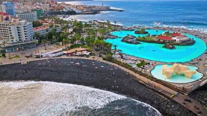 Aerial view of Lago Martiánez swimming pool, resort complex, and luxury hotels in Tenerife. Vacation destination in Puerto de la Cruz on the Canary Islands, Spain with terraces and restaurants.