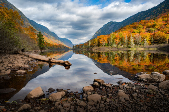 Majestic Fall foliage colors in the Jacques Cartier valley as the river flows slowly, Quebec, Canada
