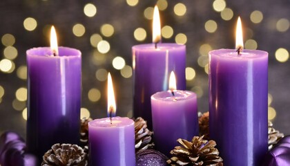 Obraz na płótnie Canvas purple candles with flickering flames