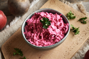 Vegetable salad made of beetroot and sour cream in a bowl