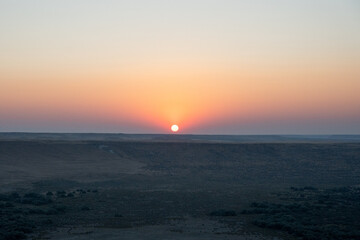 View from the top of Bruneau Sand Dune at Sunset in Idaho.  The tallest sand dunes in North America located in the western part of the United States.  Beautiful setting sun.