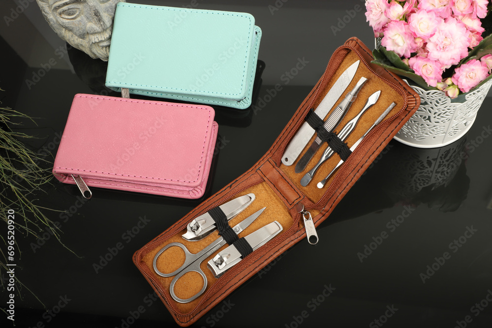 Wall mural Manicure set kit in Colorful leather case. Concept shot, top view, different colors Manicure set. Special background Manicure set view.