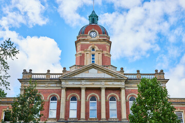 Fototapeta na wymiar Elkhart County courthouse on blue sky day with fluffy white clouds, law and order, summer day, IN