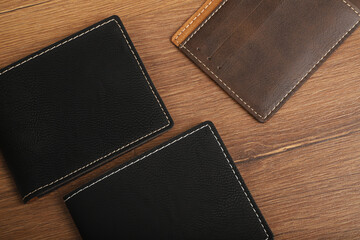 Colorful man wallet. Concept shot, top view, different colors man wallet. Special wooden background man wallet view. Men fashion and accessories.