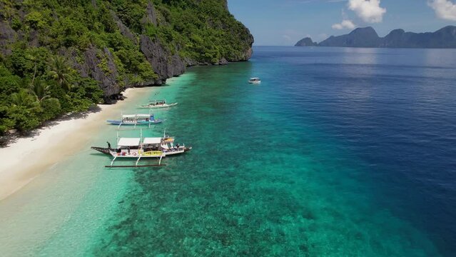 Aerial footage of tropical island beach in the Philippines 