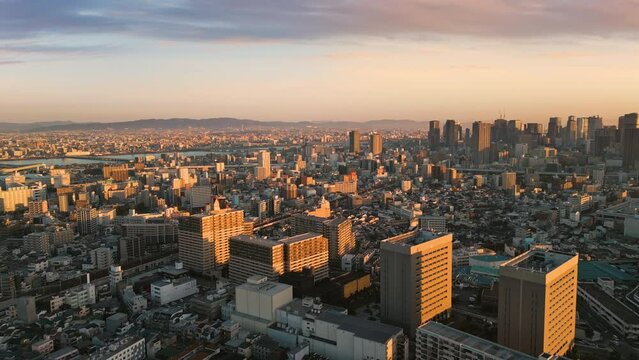 osaka city skyline aerial view drone at sunrise umeda ward business and financial district at dawn