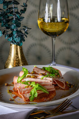 Mortadella Toast on a Croissant with pistachio, honey and arugula