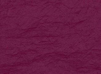 A crinkled reflective synthetic fabric texture in red