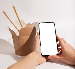 Mobile phone screen mockup, smartphone, cellphone for ordering Asian food, noodles in package, box
