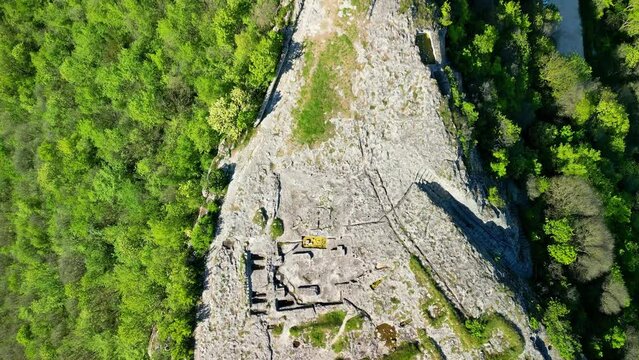 Ovech Fortress is a stone stronghold located east of the town of Provadia, Bulgaria. The fortress was inhabited successively by Thracians, Romans, Byzantines, Bulgarians, and Turks. sunset sky - Image