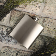 Silver colors stainless flask. Concept shot, top view. Custom background flask view. Flask and accessories.