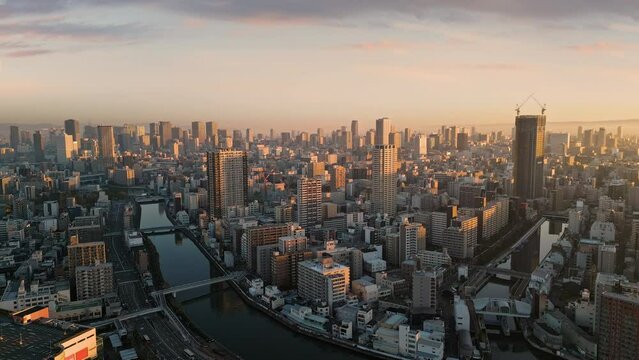 aerial view of osaka city skyline at sunrise dawn minami nishi ward with business financial umeda district in the background