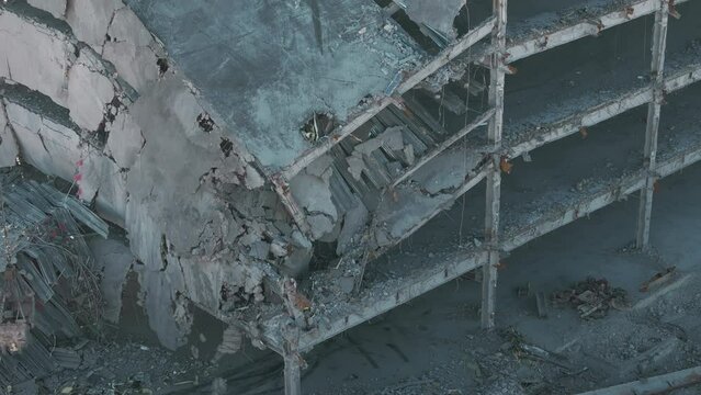 Aerial shot of destroyed buildings. Demolition of the building. Drone shot of destroyed buildings.