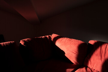 Beam of light falling on the sofa - 696551521