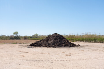 Pile of manure to fertilize the field - 696551540