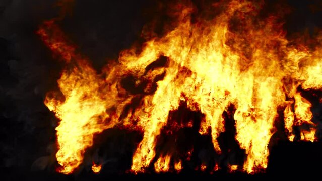 A relentless blaze consumes the outer structure and its rooftop, casting a fiery glow against a deep black background. Perfect for impressive video projects. VFX with alpha channel.
