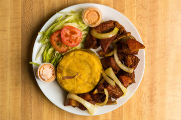 Mashed plantains with roasted pork